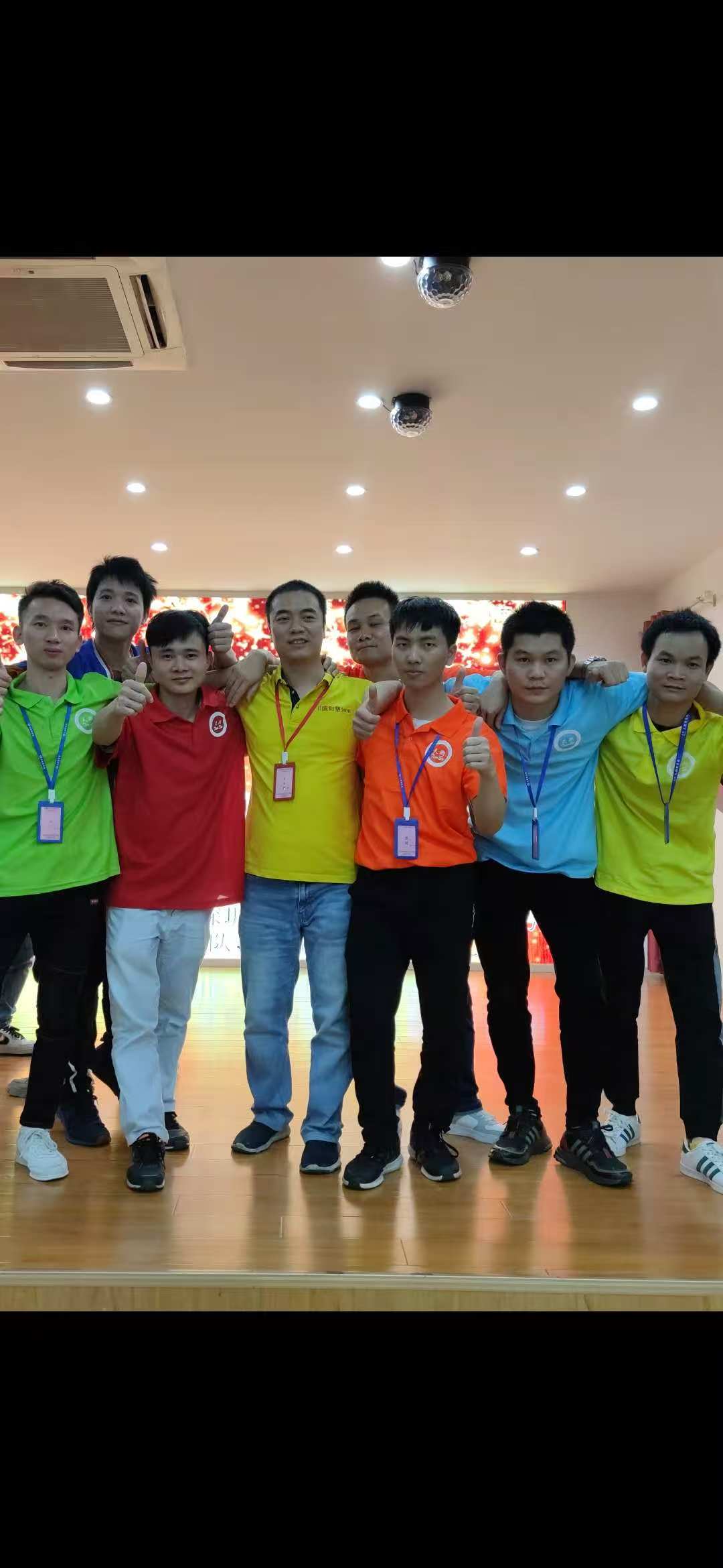 Team members standing together indoors
